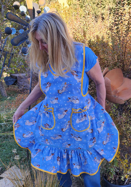 Angels on blue apron