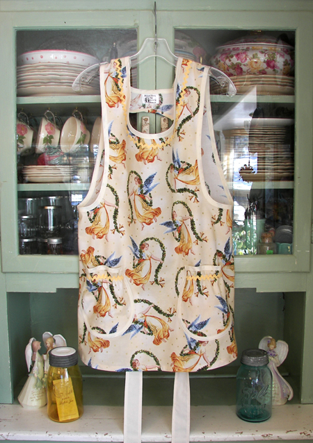 Angels on cream apron